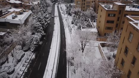 flying slow like a bird on a snow covered street in winter in tehran iran