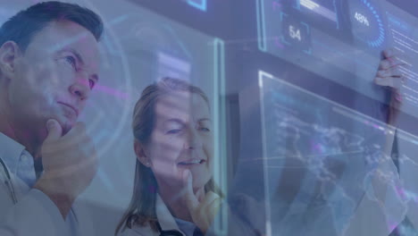 analyzing digital screens with data and graphics, medical professionals using animation