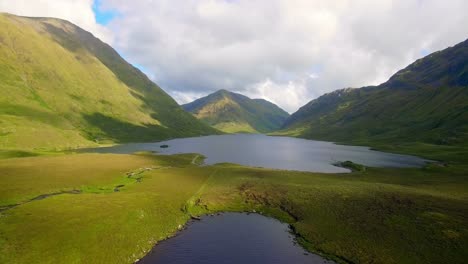 lake surrounded by beautiful mountains 4k