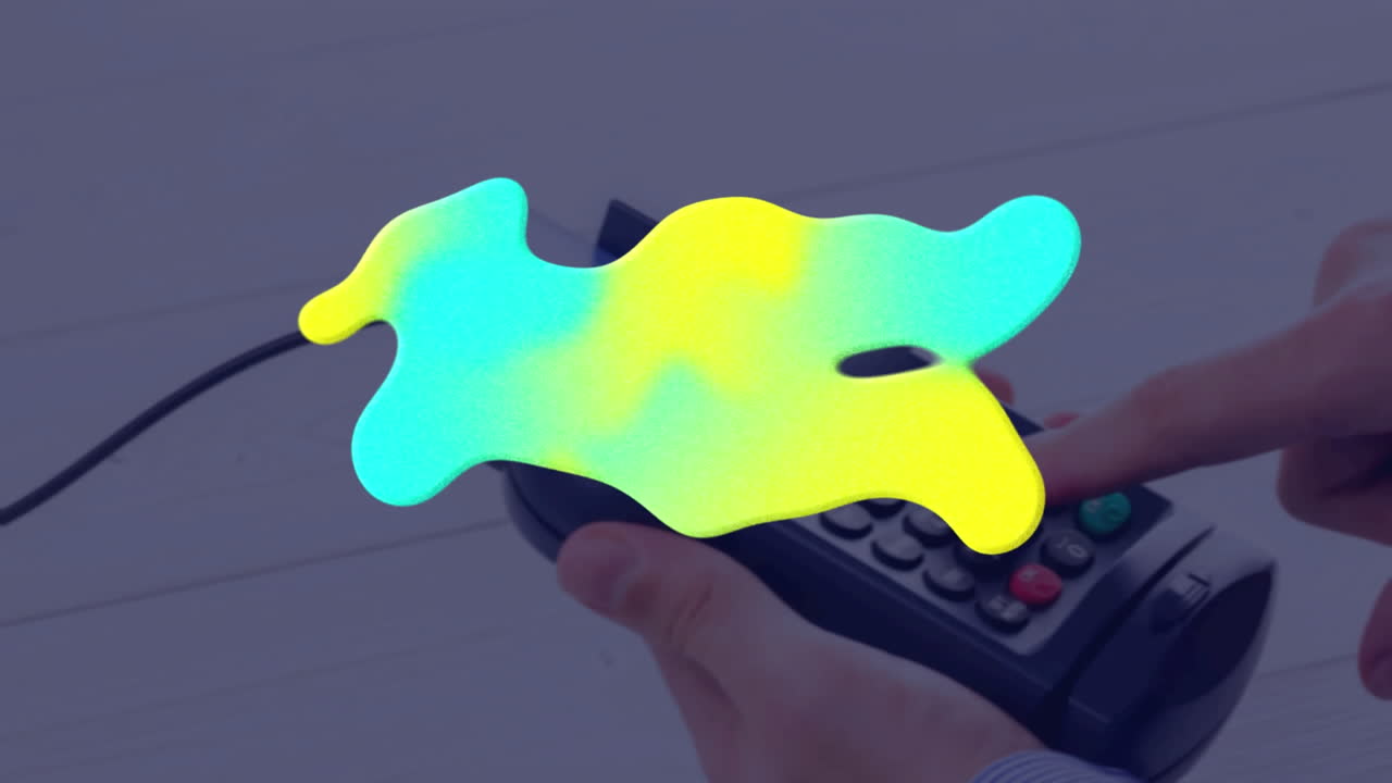 animación de una mancha colorida sobre el terminal de pago