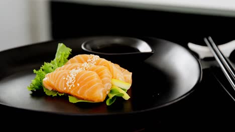 sashimi served on plate with soy sauce