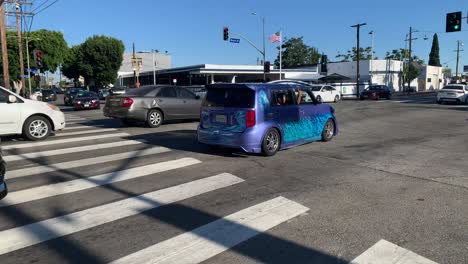 cars-pass-through-busy-lane-in-intersection