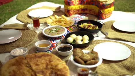 view of an egyptian breakfast in the garden, close up shot, high angle shot