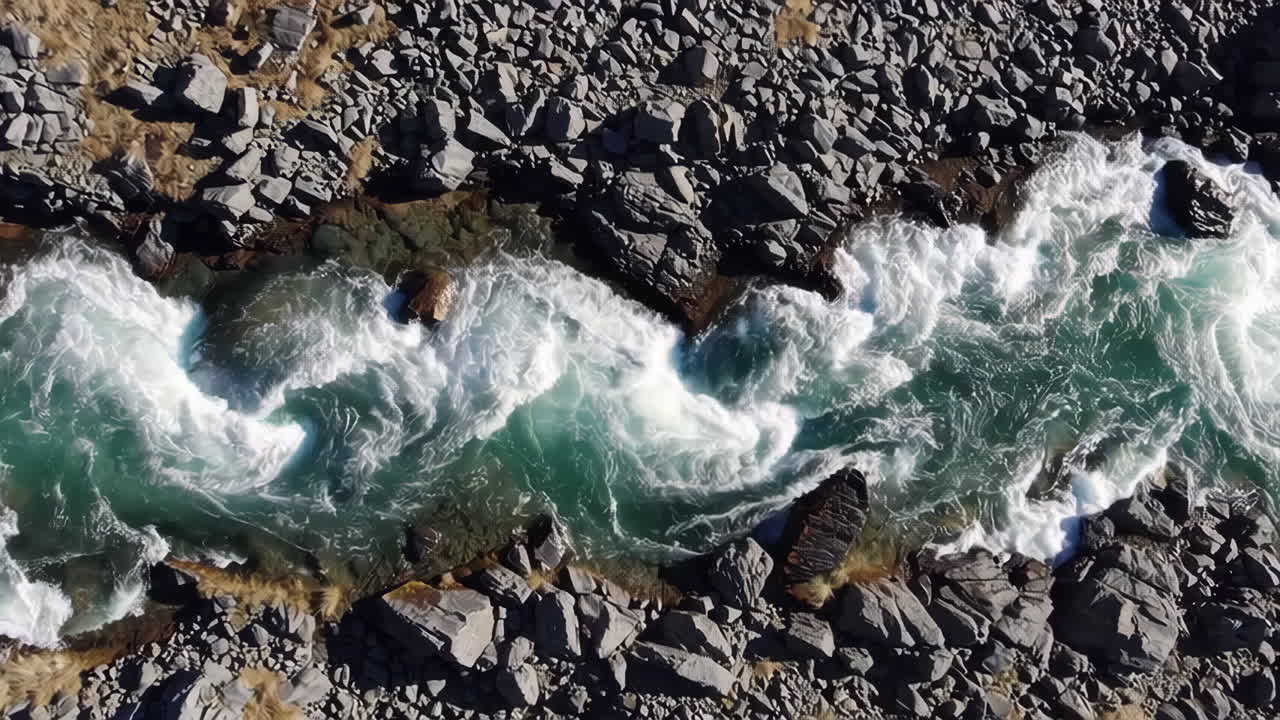 Aerial View of Whitewater Rapids and Rocky Riverbed