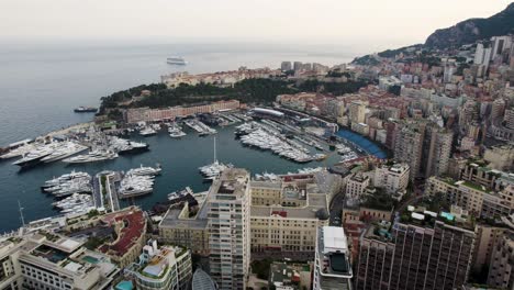 Yacht-boats-in-Port-Harbor-Marina-on-Monaco-City-Coastline,-Aerial-Drone-View