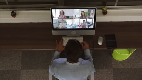 Overhead-view-of-man-having-a-video-conference-