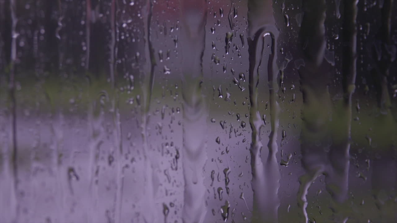 Rain water running down the outside of a window