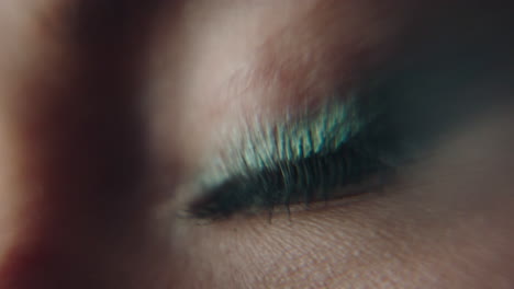 macro shot of an eye of a young woman with makeup