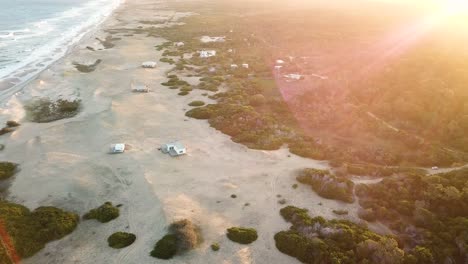 Aerial-view-over-a-beach-and-sea-in