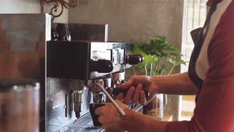 waiter making cup of coffee