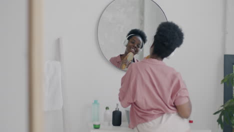 woman singing and dancing in bathroom