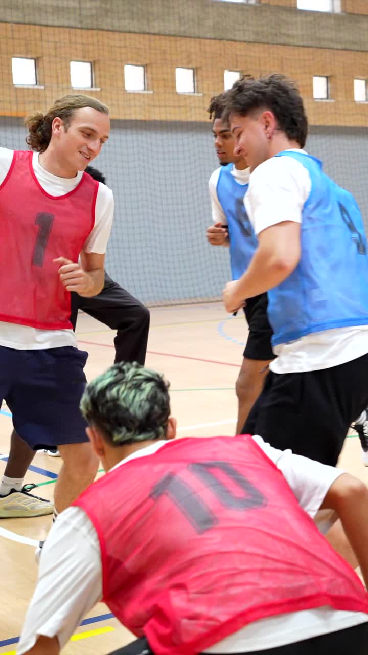 People playing indoor sports in a gym