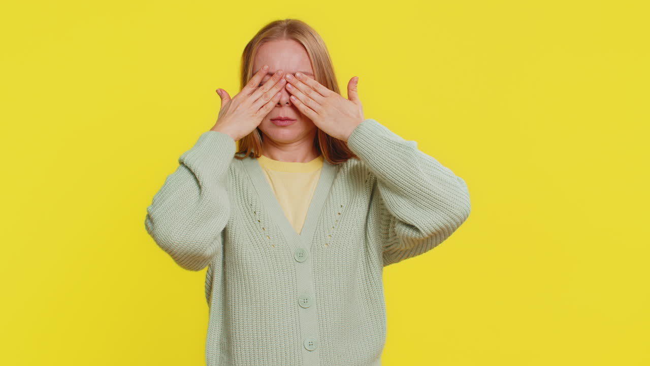 Afraid shocked woman closing eyes confused shy scared reject to watch phobia shame stress