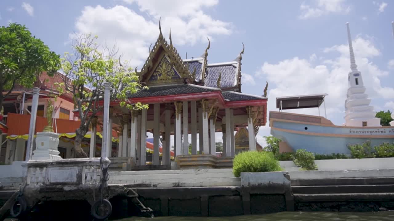 Handheld shot of traditional house next to Chao Phraya River in Bangkok, Thailand