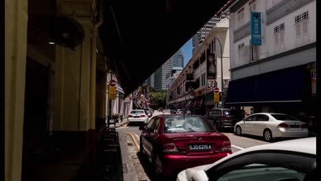 a dolly hyperlapse of china town in singapore city (day-time)