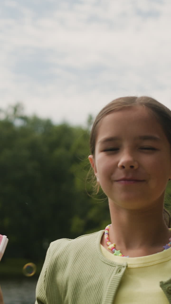 Girl playing with a bubble gun