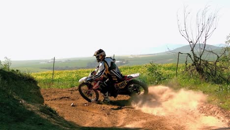 man riding a motor cross bike