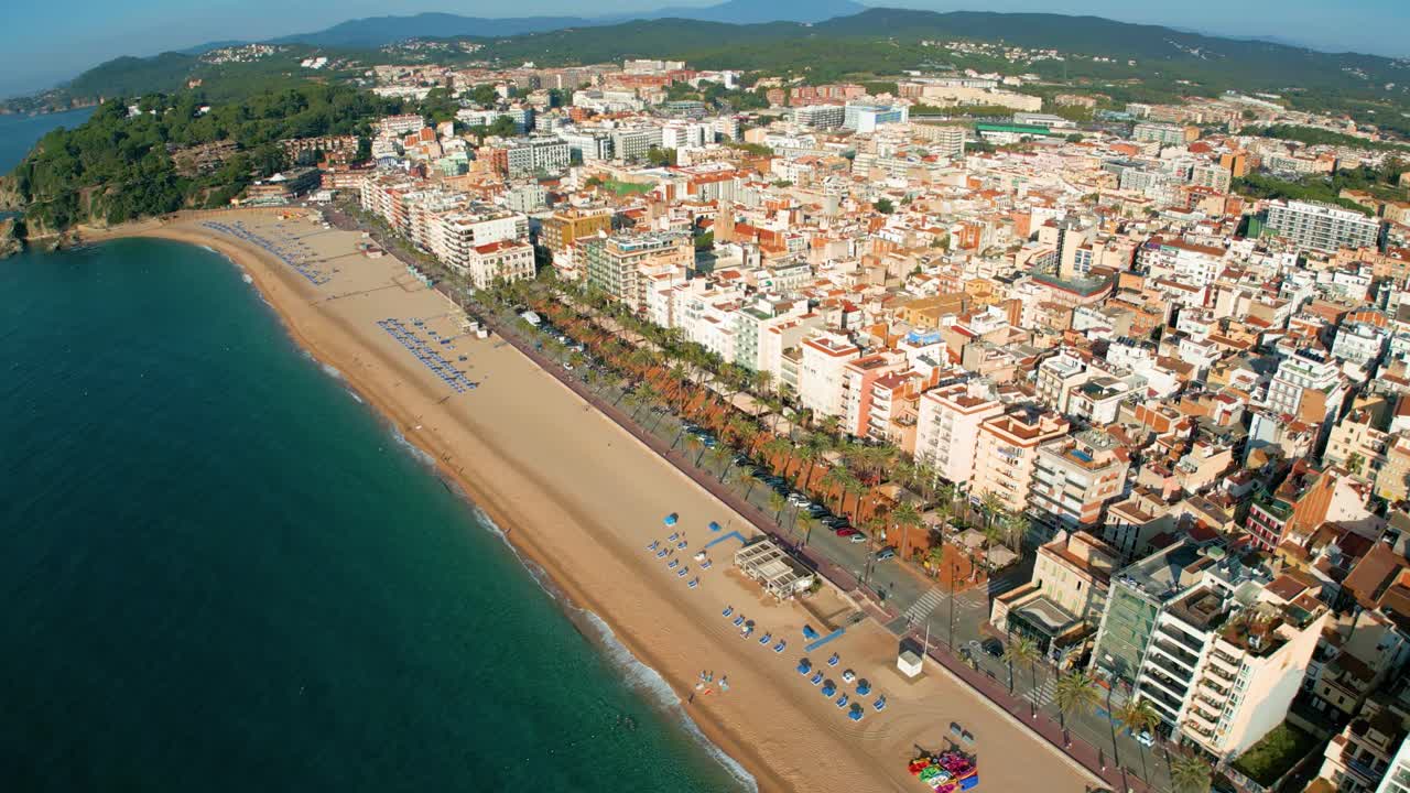 Aerial view, circular flight control of Lloret De Mar beach on the Costa Brava of Gerona, few people on the beach