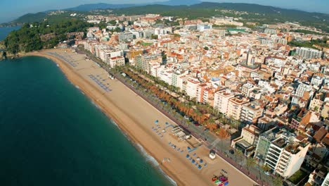 aerial view, circular flight control of lloret de mar beach on the costa brava of gerona, few people on the beach