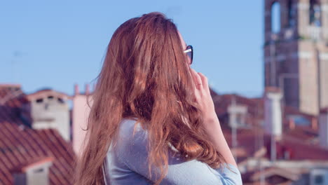 happy woman on phone call in venice