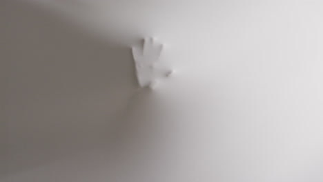 Video-of-shapes-of-hands-moving-on-white-background