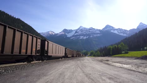 train moving fast along the tracks in the mountains