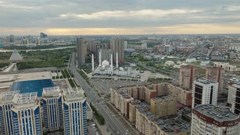 hazrat sultan mosque next to kazakh eli square at sunset in astana, kazakhstan