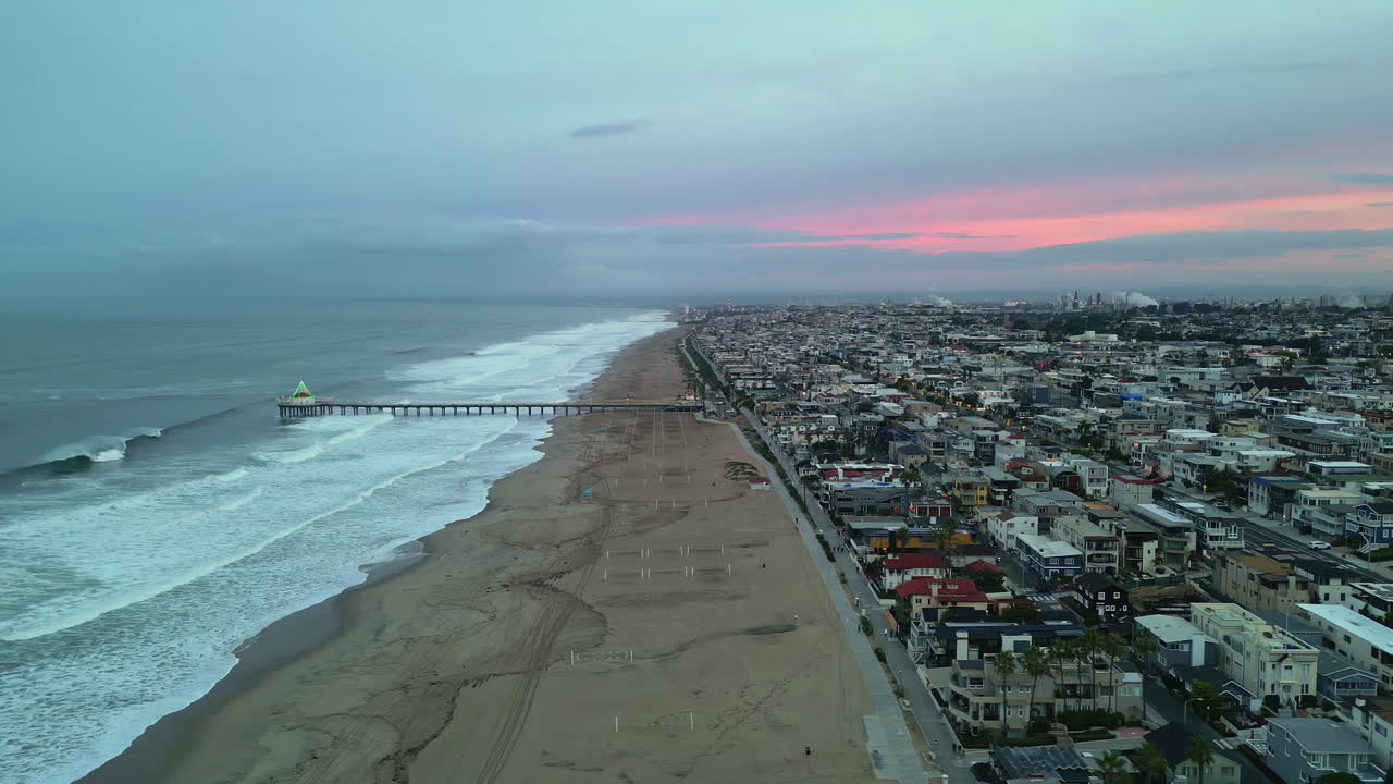 Iconic Manhattan beach and pier in Los Angeles, aerial drone view