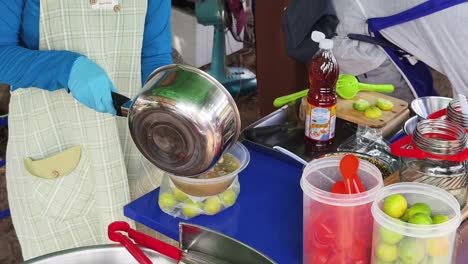 street food vendor preparing soup