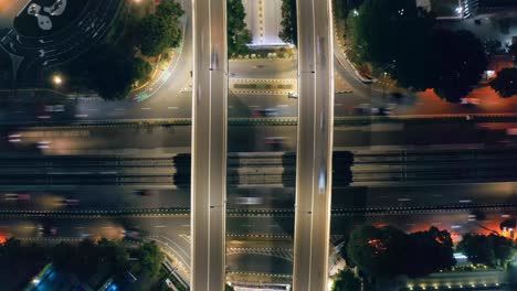 mesmerizing timelapse of traffic on overpass intersection at night in jakarta city