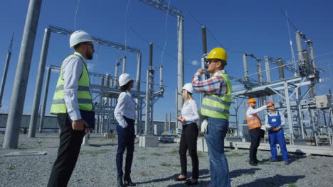 power plant engineers discussing maintenance plan