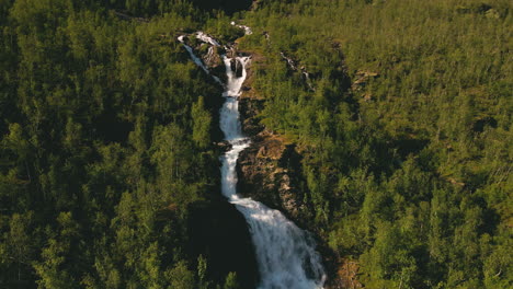 Foamy-Streams-Of-Turelva-Over-Rugged-Cliffs-Between-Vegetations-In-Finnmark,-Norway