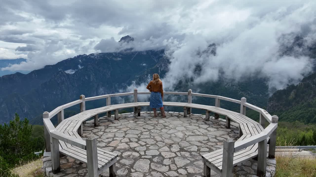 Woman Enjoys Scenic View from Viewpoint in Theth National Park AERIAL