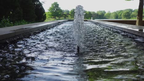 beautiful long fountain in a summer evening