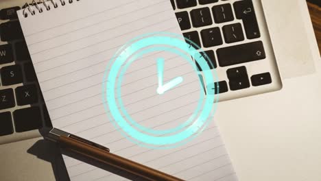 animation of clock ticking over notebook and laptop on wooden table