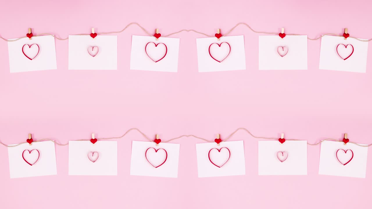 발렌타인 사랑의 마음은 종이에 인 로프에 매달려 있습니다. - 스 모션