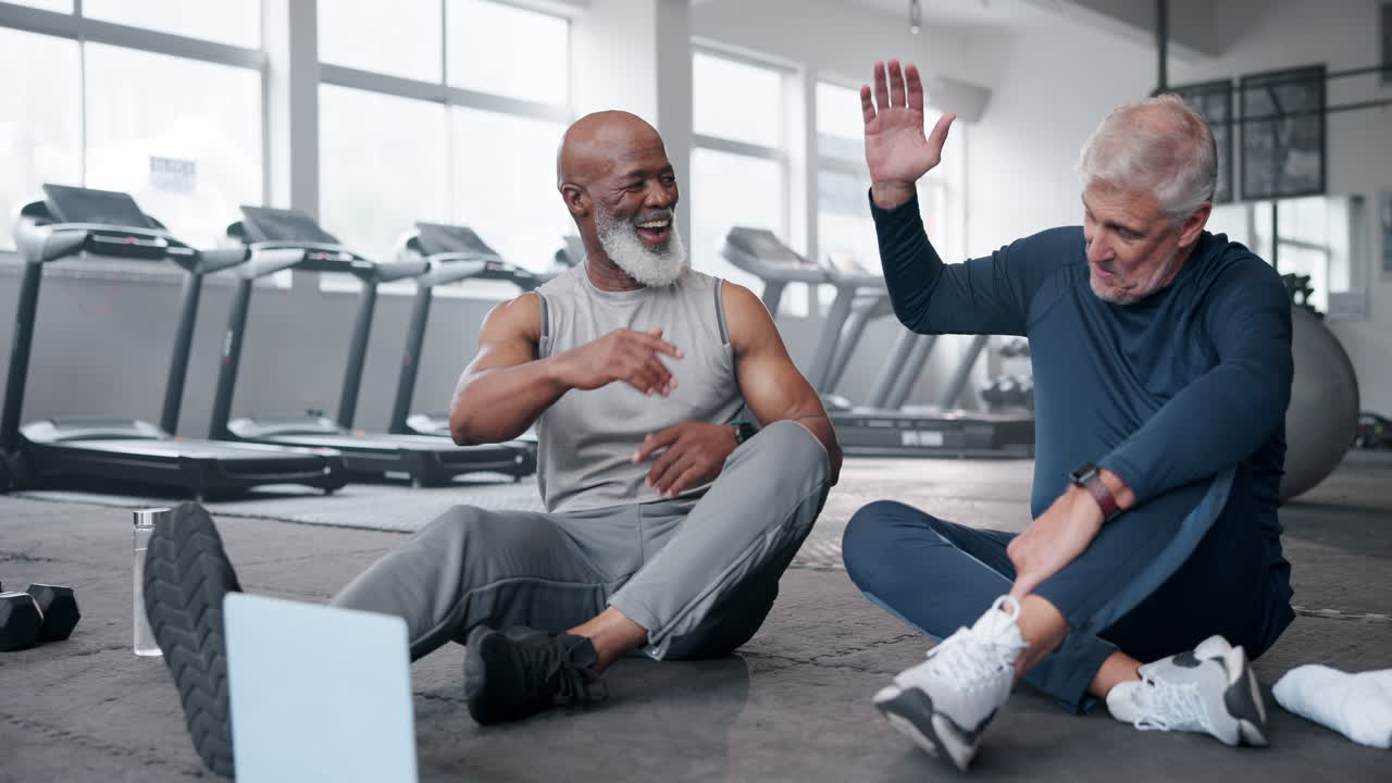 Senior Men Enjoying a Workout Together at the Gym