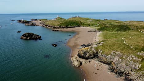 yachts sailing off ynys llanddwyn welsh tidal island aerial view establishing lush shoreline