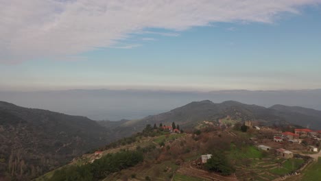 Aerial-over-scenic-valley-Lesvos,-Greece-overlooking-Turkish-coast