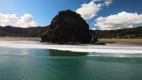 Aerial-view-of-Lion-rock,-Piha-beach-in-New-Zealand's-North-Island