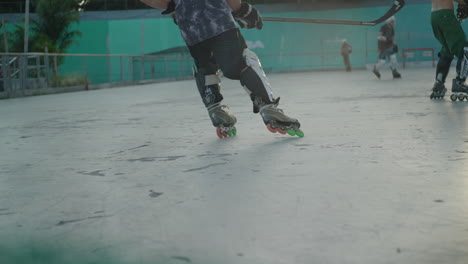 detail-slow-motion-view-rollers-of-street-hockey-player-start-a-counterattack