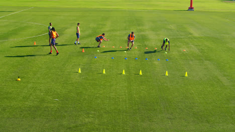 football players exercising in the field 4k