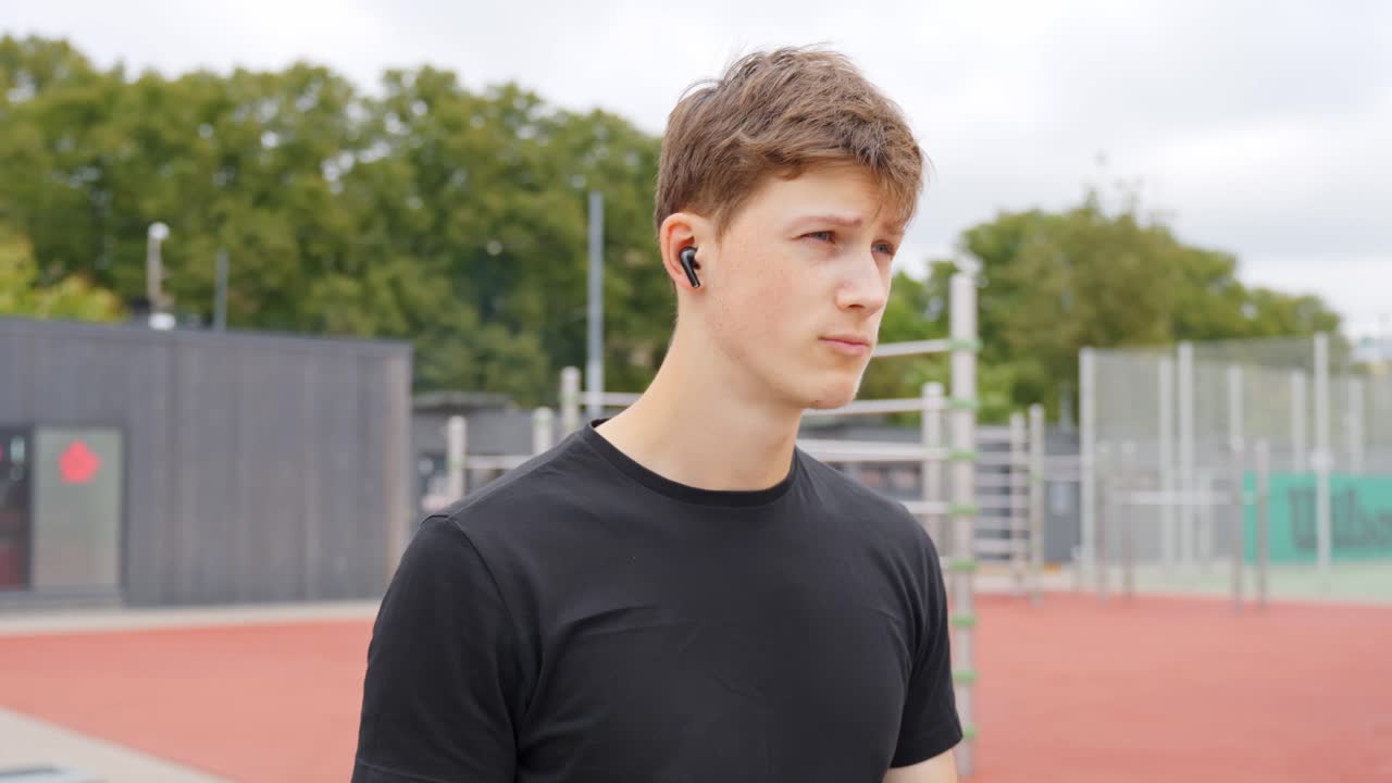 Man nods head to music getting pumped before exercise, rhythmic movements, solo focus