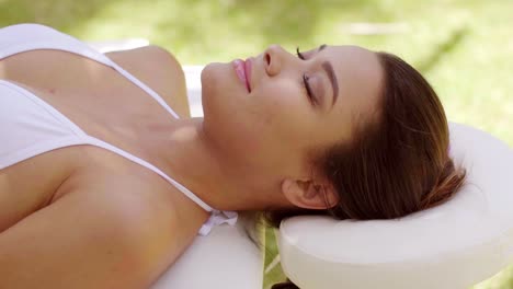 Single-woman-laying-down-in-outdoor-beauty-spa