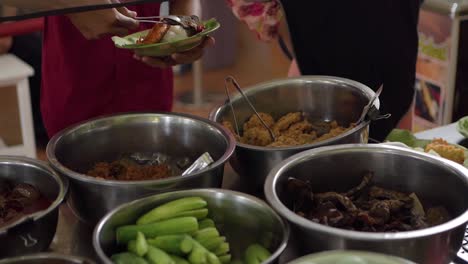 customers take fried beef lung on the nasi jamblang menu