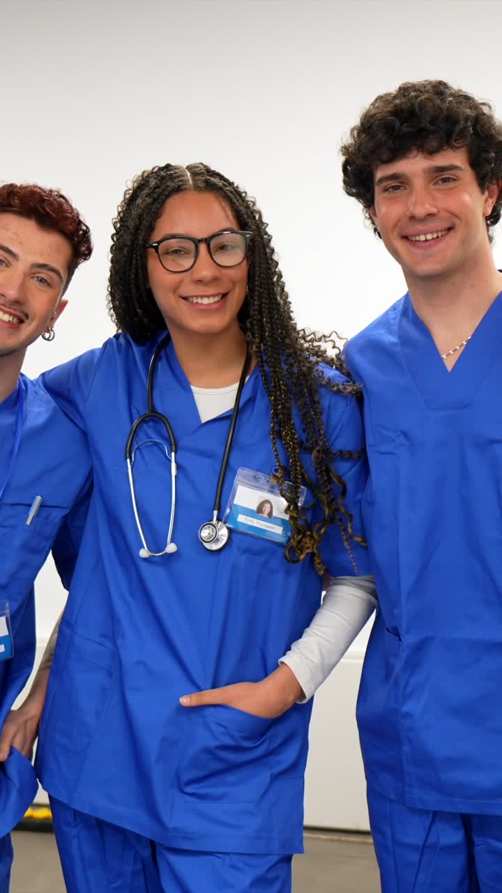 Happy Group of Diverse Medical Students Posing in Blue Scrubs
