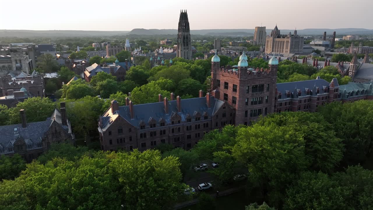 Welch Hall And Lawrence hall buildings in New Haven, usa. Sunset time with harkness tower in background. Aerial view. Green trees in campus area of university. Connecticut, America
