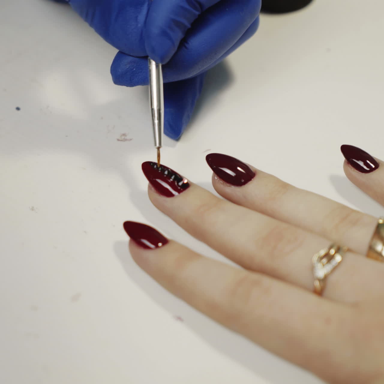 Woman getting a manicure with detailed nail art