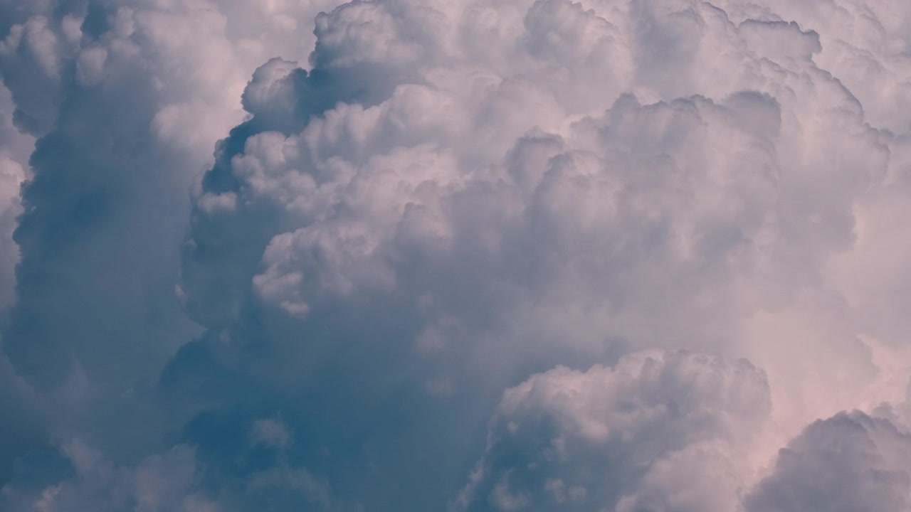 Time lapse of thick summer clouds developing into a storm