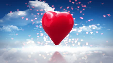 corazón rojo girando sobre el cielo azul